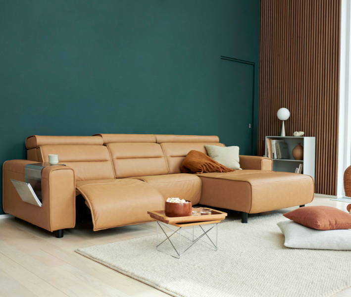 With sleek lines and a streamlined silhouette, Stressless Emily has a clean, modern look that exhibits confidence and style. The contemporary design blends effortlessly with any modern interior, while the soft cushions ooze with luxury and invite you to take a seat and relax. As one of the Stressless Power sofas, you can easily adjust the position of the footrest.

The Emily has an adjustable headrest on all seat modules so you can lower it for a sleek low-back sofa with perfect back support for sitting, or adjust the angle and height of the headrest for extra support to your head and neck.

Stressless Emily also offers a large choice of high-quality leather and fabrics, and the choice between three versions of armrests: Emily Steel and Emily Wood have slim armrests with elegant details in steel or wood, while Emily Wide has distinct upholstered armrests with luxuriously large proportions. You can also customise the layout of your sofa with modular options to create the sofa of your dreams.

Please note that we only show a limited number of configurations on our website - if you require a different configuration please contact us.
