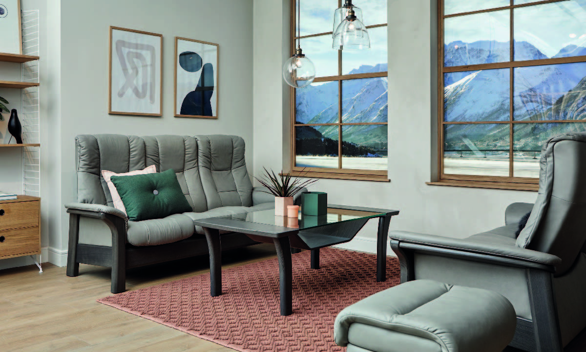 Timeless elegance meets modern functions with this beautifully cushioned, high-back sofa.

The Stressless Windsor and Stressless Buckingham are sofas that never go out of style, with their combination of soft cushions and beautiful wood.

Featuring the same design, you can choose from Stressless Windsor which is based on a medium sized seat or Stressless Buckingham which features a wider seat. They also have the Plus™-system, which means that the sofa follows your movements and provides good support in all sitting positions.

Available as a 3 Seater, 2 Seater or Chair with a wide choice of premium leathers, fabrics and wood finishes, the Buckingham brings pure, classic comfort to any living space.
