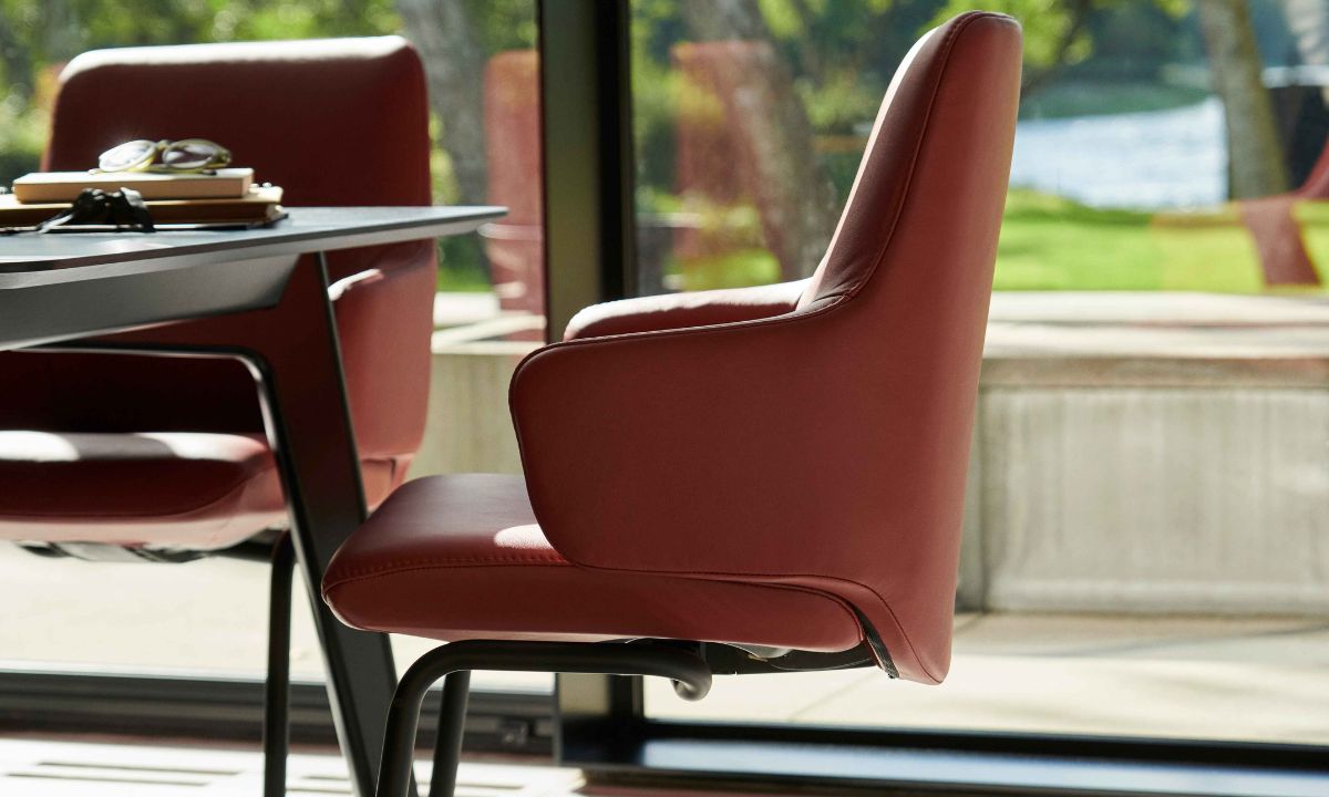 The Stressless Laurel dining chair brings the renowned comfort of Stressless into the heart of your home - the dining room. With its streamlined design and sculpted backrest, the Laurel combines refined style with exceptional functionality.

Equipped with BalanceAdapt™ technology and the Glide-system, the chair subtly moves with your body as you sit, lean, or shift, offering a more relaxed and natural dining experience. Whether you’re hosting guests or enjoying a quiet meal, the Laurel ensures long-lasting comfort without compromising on aesthetics.

Available in medium or large with high or low backrests, and a choice of wood or metal legs plus a variety of leather and fabric finishes, the Laurel can be tailored to match your personal style and dining space perfectly.
