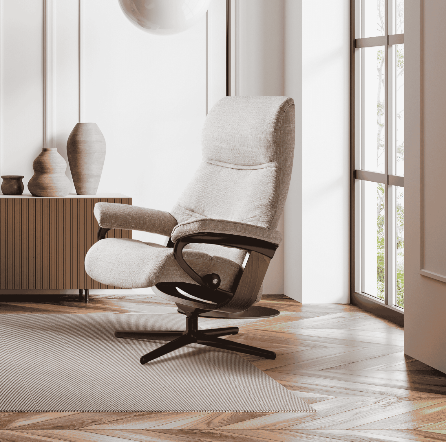 The Stressless Paul recliner is visually appealing, with curved lines and extra foam added on the sides of the backrest. The wing-shaped backrest with extra padding plus covered armrests provide the comfortable feeling of being hugged whilst sitting, alongside a smile-shaped seat that allows you to really sink into the chair. The headrest can be lengthened by up to 7cm, making Stressless Paul their tallest recliner to date.
Beneath its premium detailing, the Paul recliner features the patented Plus™ and Glide™ systems, which automatically adjust to your body’s movement.
Choose from a Cross or Signature base and customise your recliner with a variety of leathers, fabrics, wood and metal colours.